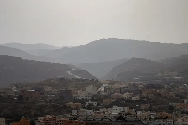 Mountain town under low clouds